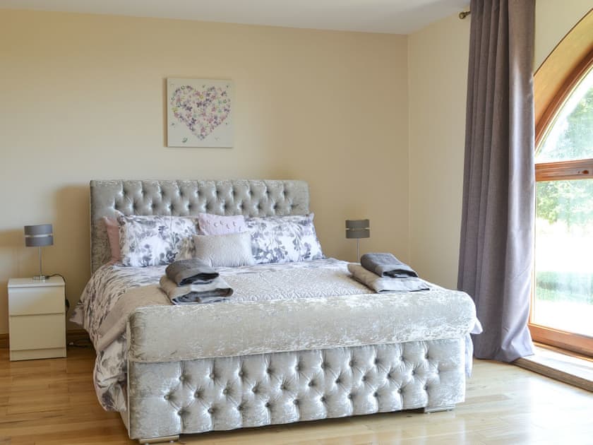 fabulous master bedroom with kingsize bed, cot, large picture window, dressing room and large en-suite bathroom | Applegarth House, Howlish, near Bishop Auckland