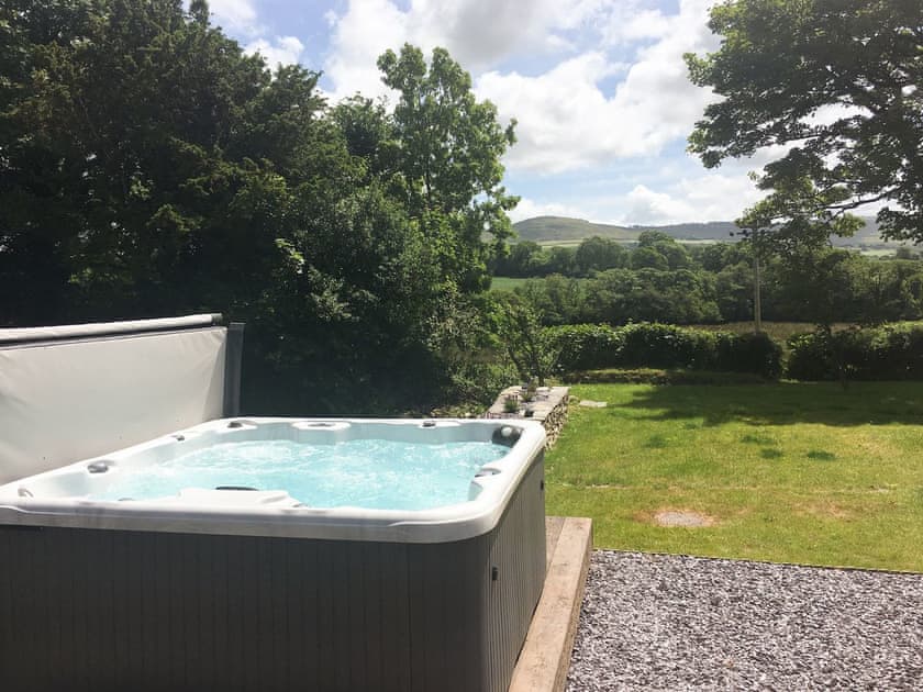 Relaxing hot tub overlooking garden | Fountain Hill, Eglwyswrw, near Cardigan