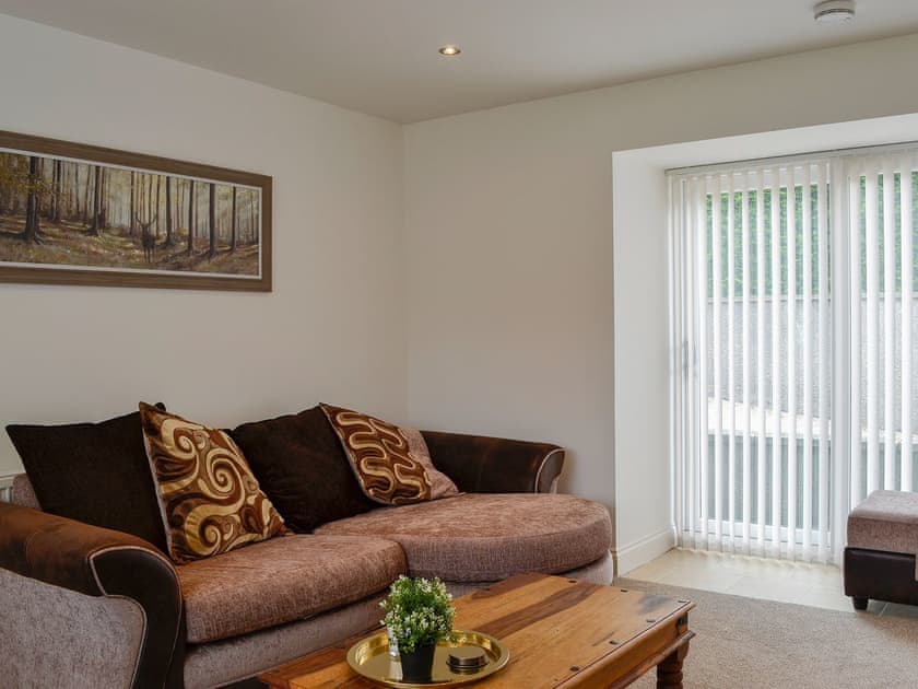 Living room with patio doors | Kirroughtree Steading 1 - Kirroughtree Steading Holidays, Newton Stewart