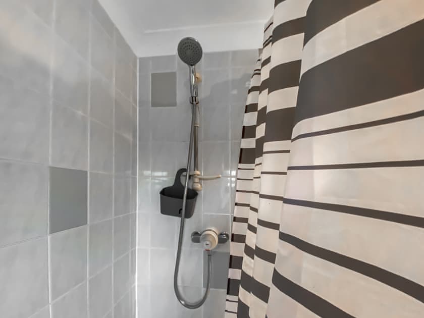 Shoer over the bath in the bathroom | Tamarisk, Walcott