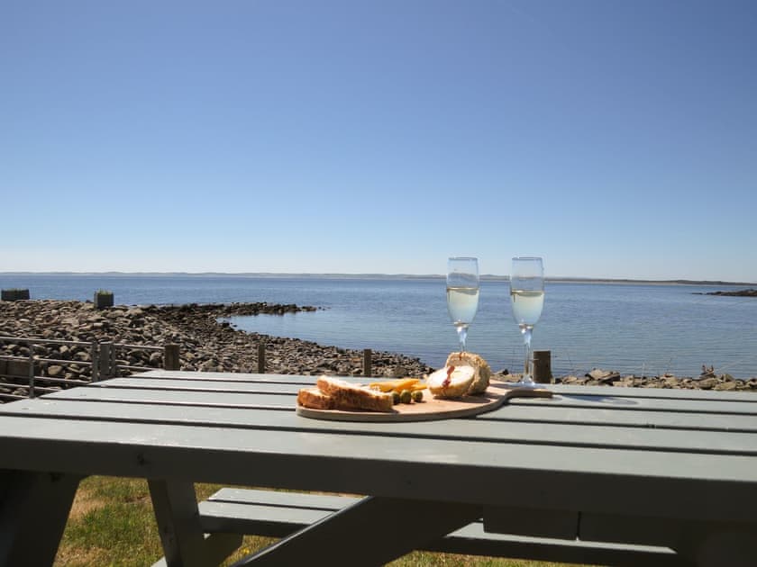 Outdoor furniture with amazing views | Fisherman’s Cottage, Stairhaven by Glenluce