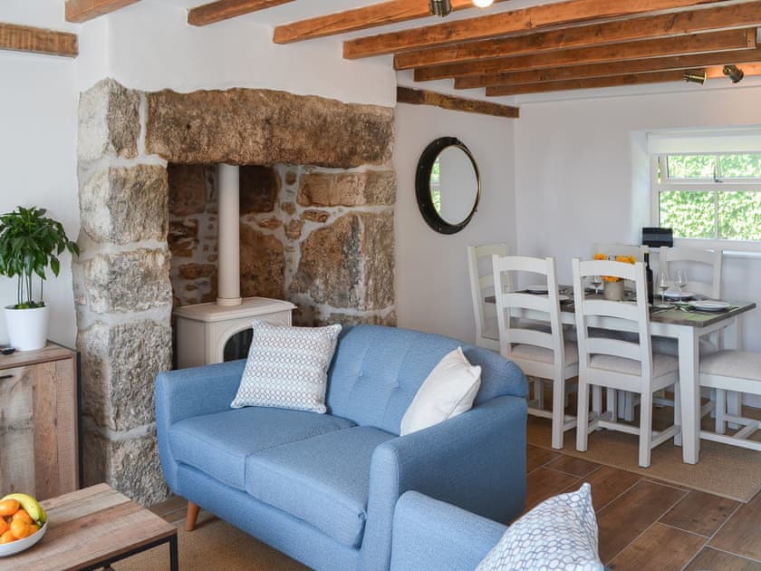 Delightful living area with feature fireplace | Bryn Awel, Moelfre, near Benllech