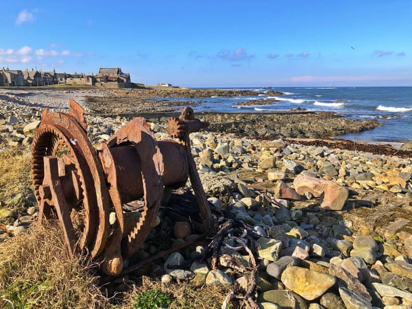 Cairnbulg beach with old winch used to pull old boats up the shore. with the Beacon and the Sovereign in the back ground | Cotton Shore, Inverallochy, near Fraserburgh