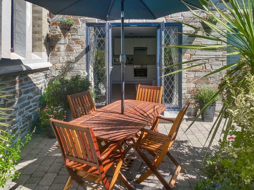 Enclosed patio with outdoor furniture and BBQ | Old Church School, Plympton, near Plymouth