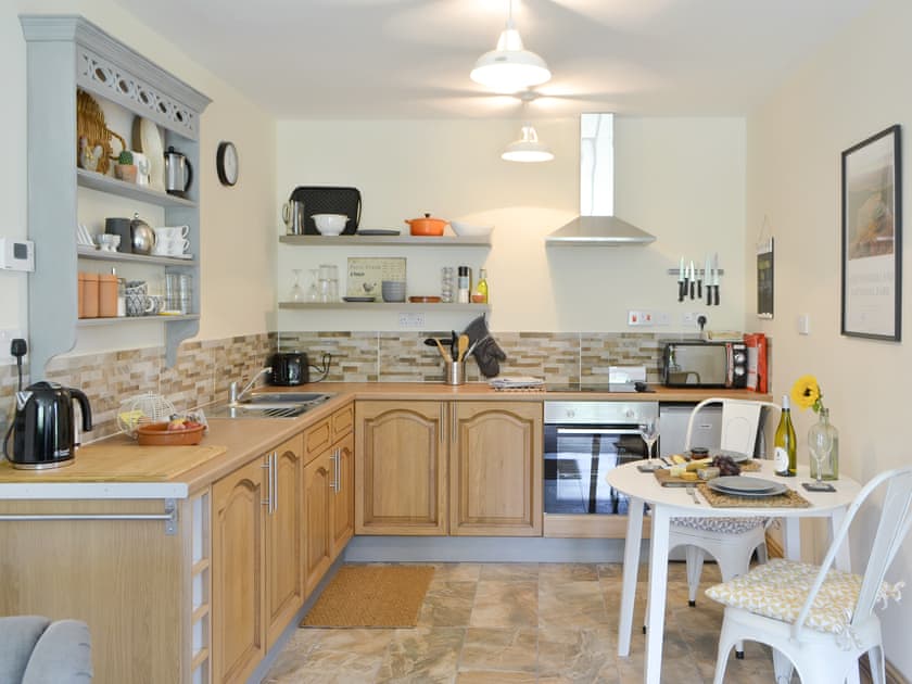 Well-equipped fitted kitchen with dining area | Lapwing Cottage - High Weldon Cottages, Weldon Bridge, near Rothbury