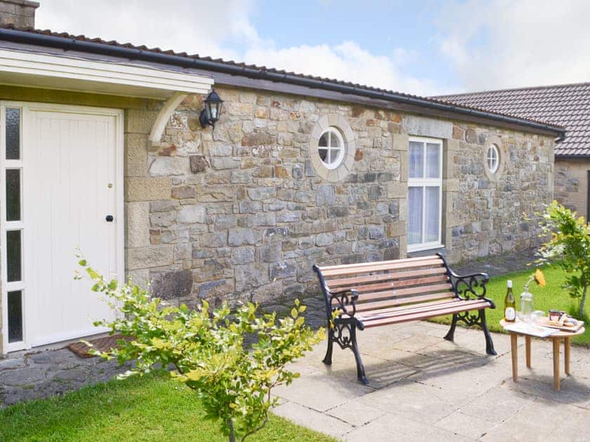 Paved patio area with outdoor furniture | Lapwing Cottage - High Weldon Cottages, Weldon Bridge, near Rothbury