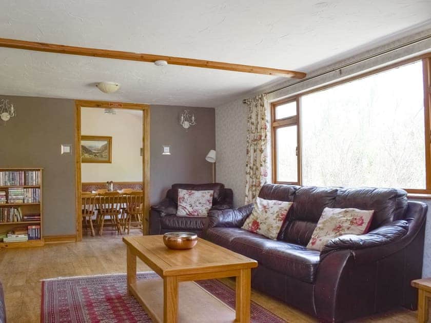 Spacious living room with door to dining area | Captain’s Quarters - Keel Lodges, Staithes, near Whitby