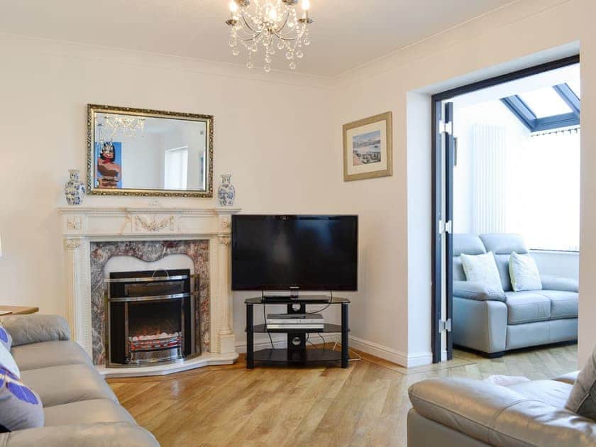 Welcoming living and dining room with access to the sun-room | Harbour Gates, Maryport