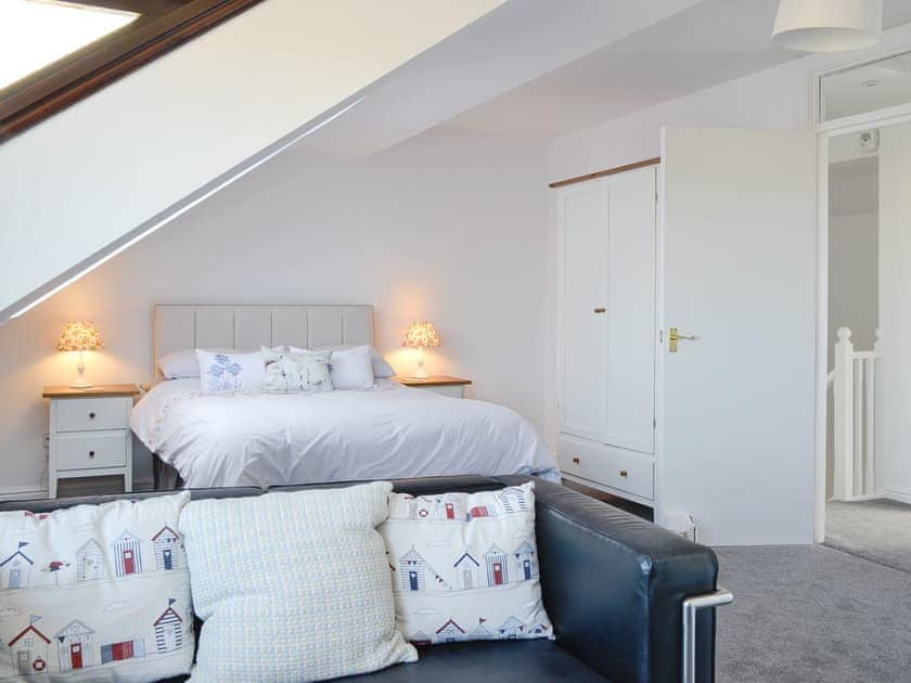 Master bedroom suite with seating area | Harbour Gates, Maryport