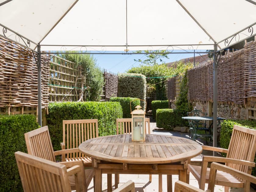 Pretty patio and garden with decking and outdoor furniture | Courtenay Street 5, Salcombe