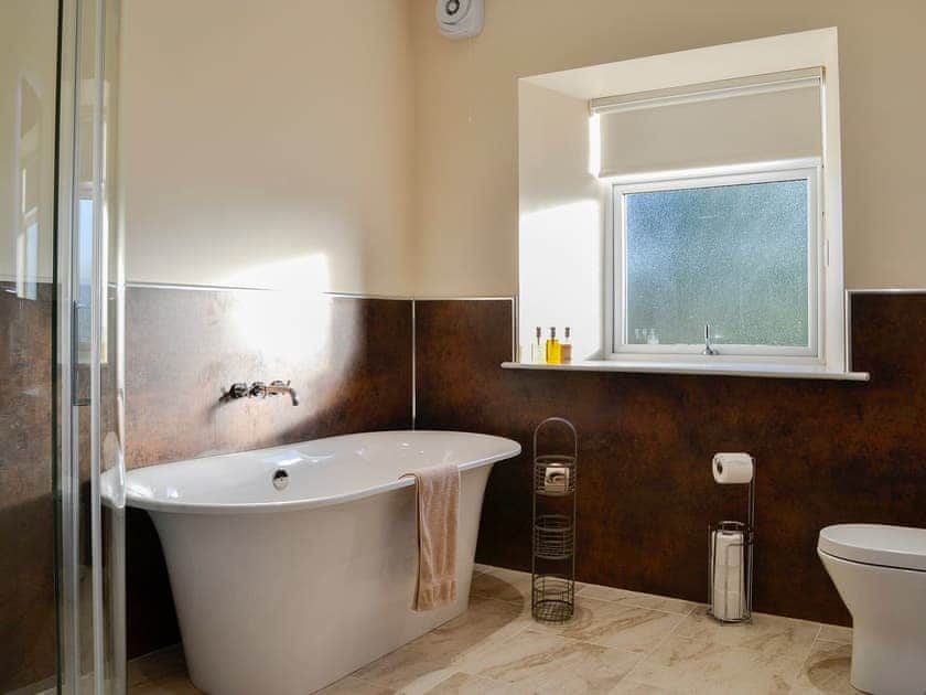 Bathroom with standalone bath and shower cubicle | Liftingstane Dairy Cottage - Liftingstane, Closeburn, near Thornhill