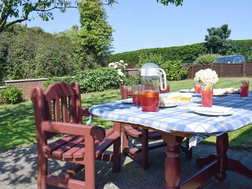 Peaceful sitting out area within garden | Cherrytree Cottage, Loftus, Saltburn-by-the-Sea