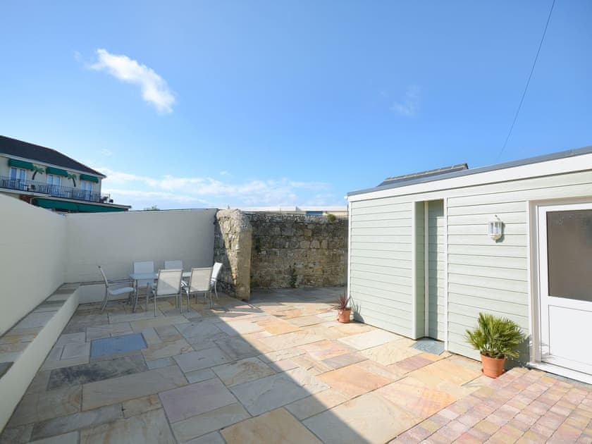 Relaxing courtyard with garden furniture | Seagulls, Sandown