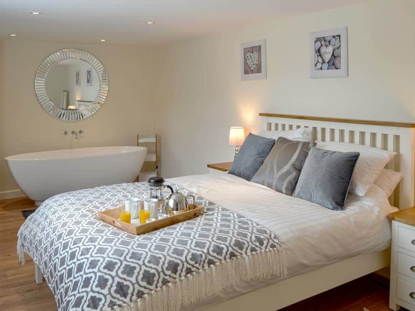 Romantic double bedroom with free standing bath | Broadland Hideaway, Martham, near Great Yarmouth