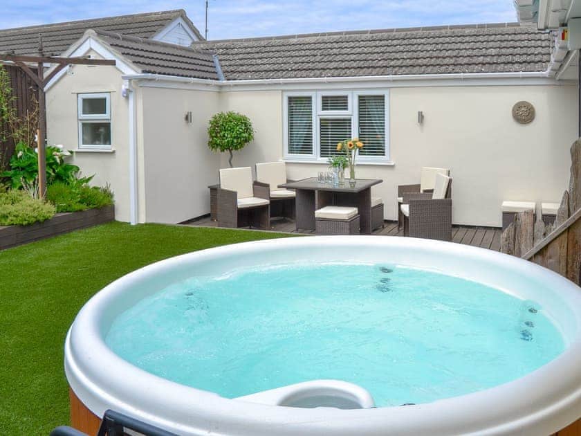 Delightful garden with private hot tub | Broadland Hideaway, Martham, near Great Yarmouth