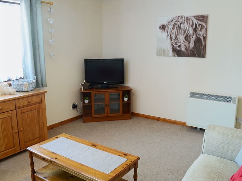 Attractive good-sized living room | Acorn Cottage, Conon Bridge