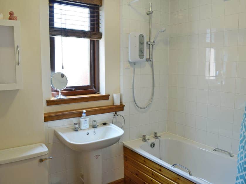 Bathroom with shower over bath | Acorn Cottage, Conon Bridge