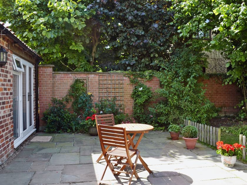 Relaxing courtyard with sitting-out area | The Old Forge, Saxilby, near Lincoln