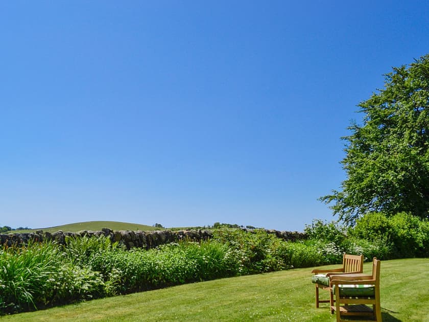 Peaceful sitting out area in the garden | Carse Cottage, Twynholm by Kirkcudbright