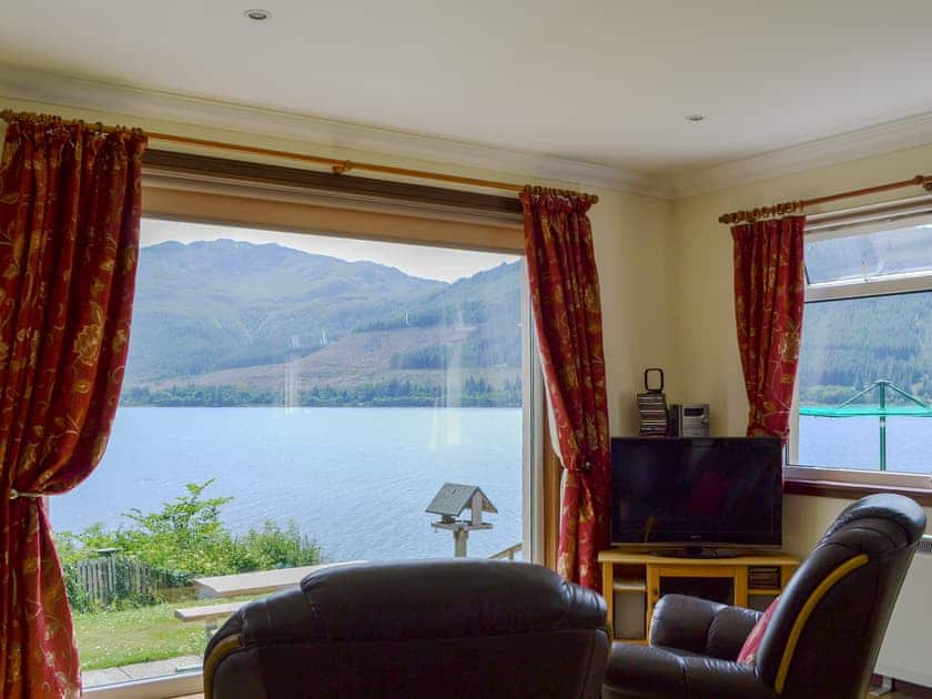 Stunning views of the Loch from the living area | Shoreside - Mullardoch Cottages, by Inverinate, Kyle