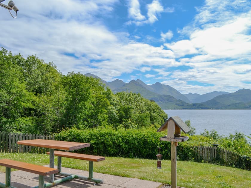 Delightful garden with sitting out area | Shoreside - Mullardoch Cottages, by Inverinate, Kyle