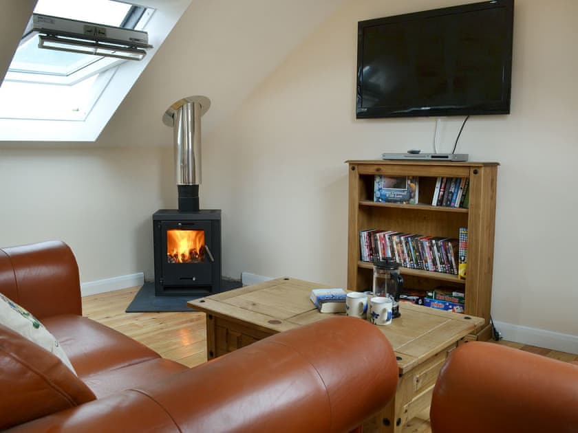 Cosy living area with wood burner | Stonechat Barn - Little Derril, Derril, near Bude