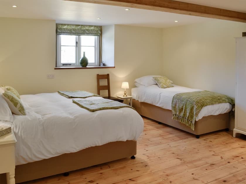 Bedroom with zip and link twin beds (can be super kingsize on request) and single bed | The Farmhouse - Round Chimneys Farm, Glanvilles Wootton, near Sherborne