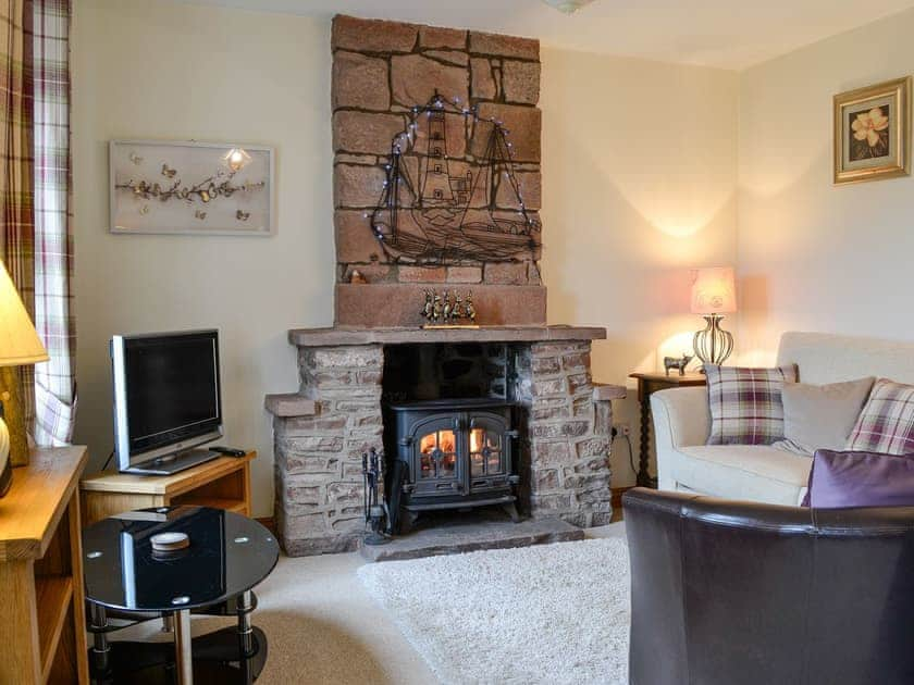 Living room with cosy wood burner | Rose Cottage - Springfield Farm Cottages, Bigrigg, near Egremont