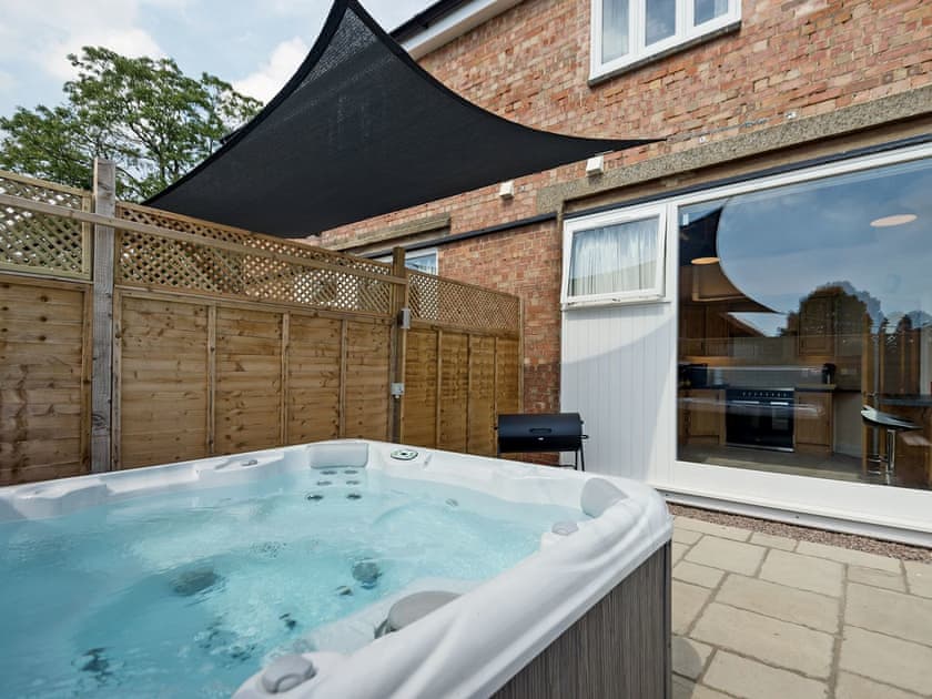 Inviting, private hot tub | Church View - Riverside Barns, Wainfleet St. Mary, near Skegness