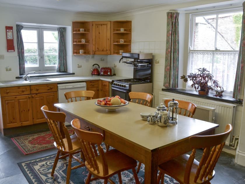 Kitchen with dining area | The Farmhouse - Lanwithan Cottages, Lostwithiel