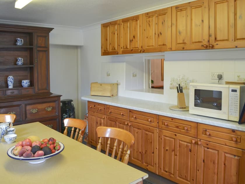 Kitchen with dining area | The Farmhouse - Lanwithan Cottages, Lostwithiel