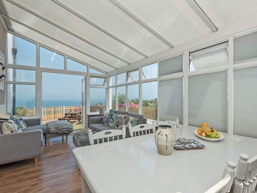 Impressive conservatory with French doors leading to garden | Marion’s Sea View, Overstrand, Cromer