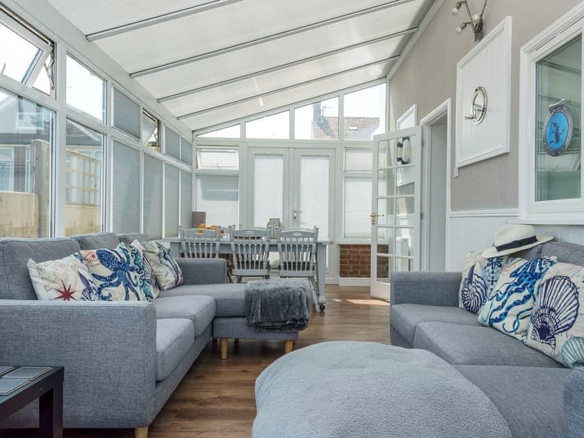 Impressive conservatory with French doors leading to garden | Marion’s Sea View, Overstrand, Cromer