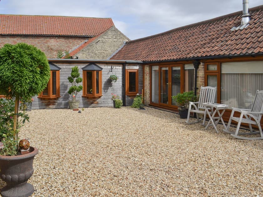 Enclosed courtyard with sitting-out area, | The Olde Barn, Welton, near Lincoln