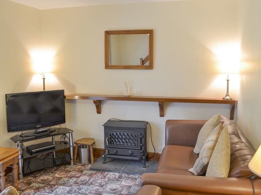 Welcoming living room with wood burner | Bodwi Isaf - Bodwi Farm Cottages, Near Abersoch
