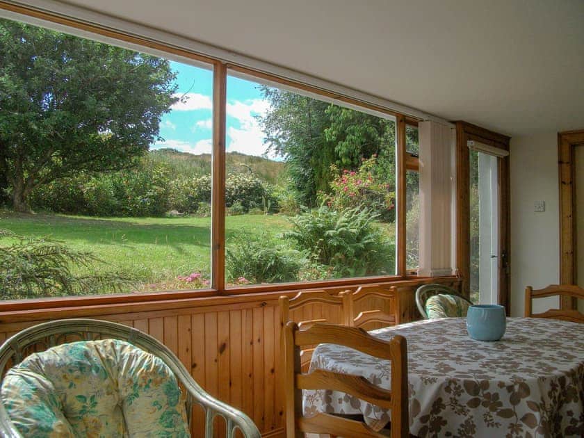Dining area with garden views | Lower Brae, Strath Oykel, by Ardgay