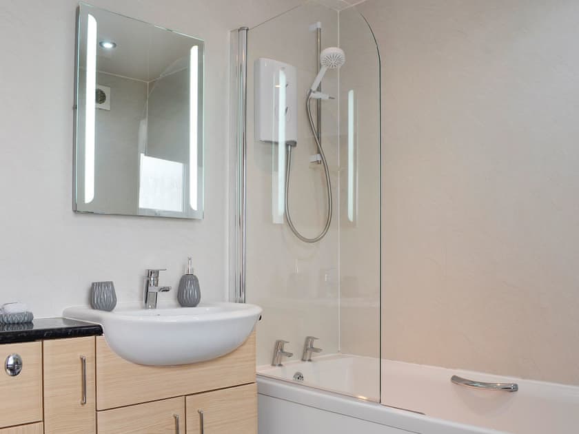 Bathroom with shower over the bath | Creel Cottage, Auchmithie, near Arbroath