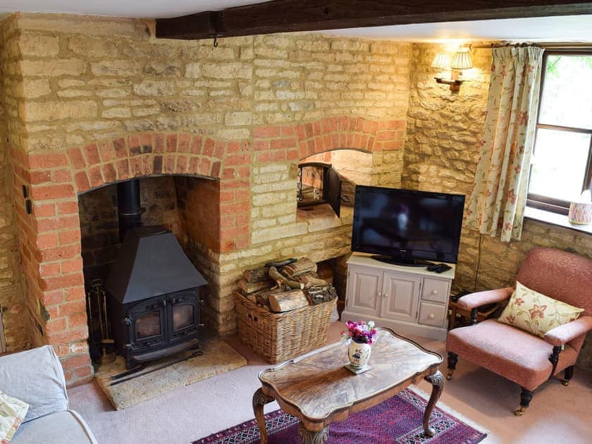Cosy living room with wood burner | Picket Piece Cottage, Chadlington, near Chipping Norton