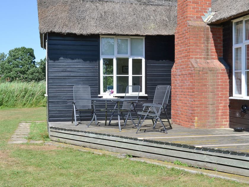 Raised decked area with table and chairs | The Studio, Hickling