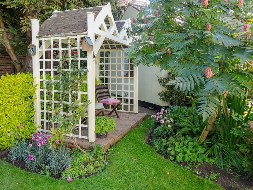 Charming sitting out area in the shared garden | Brook Lodge Country Cottage, Wroot, near Doncaster