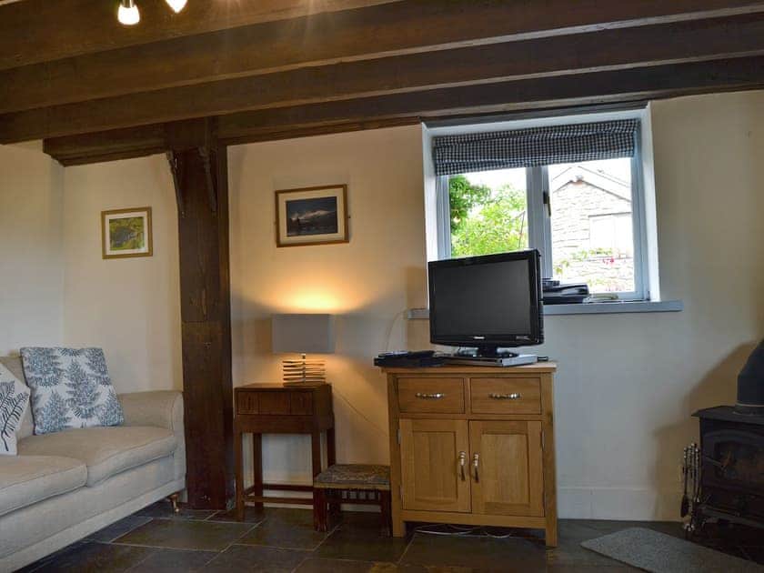 Cosy living area with wood burner | The Pigsty Cottage, Oswestry