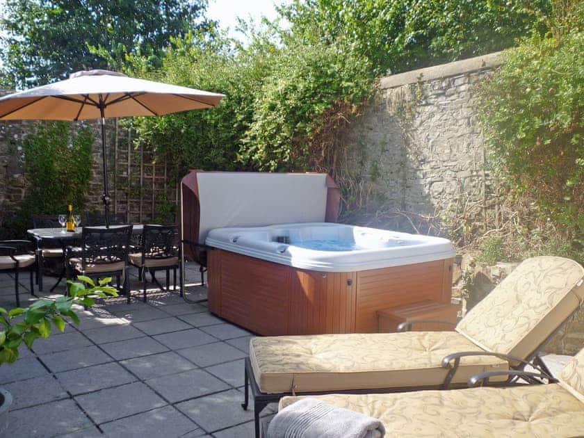 Inviting hot tub in courtyard | The Orangery, Bideford
