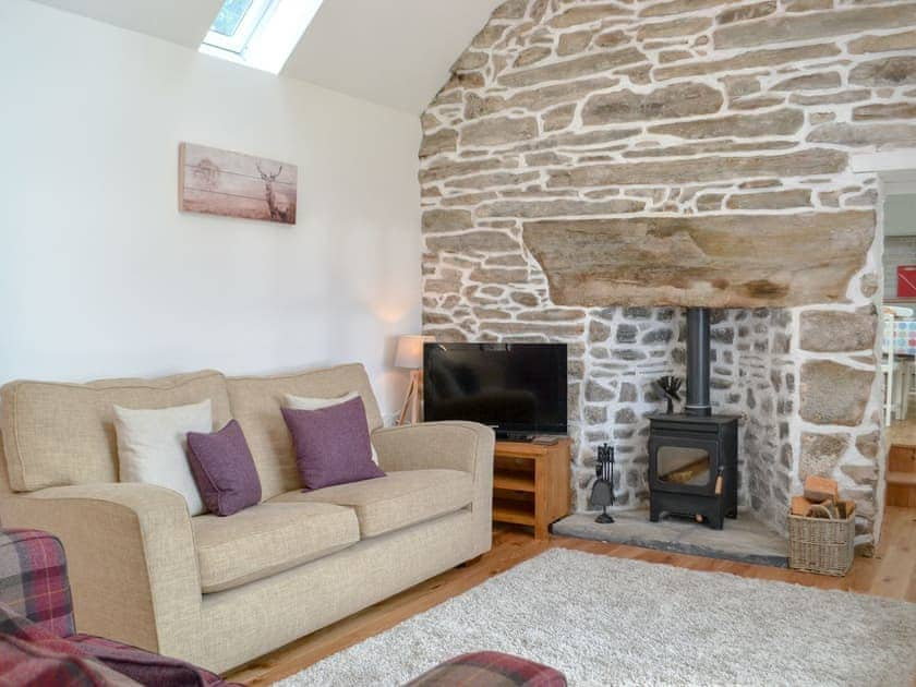 Characterful living room with cosy wood burner | Wester Laggan Cottage, Dulnain Bridge, near Grantown-on-Spey