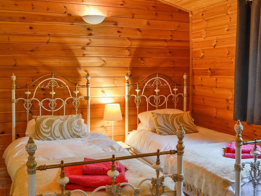 Twin bedroom with antique style  beds | Edw Lodge - Boatside, Aberedw, near Builth Wells