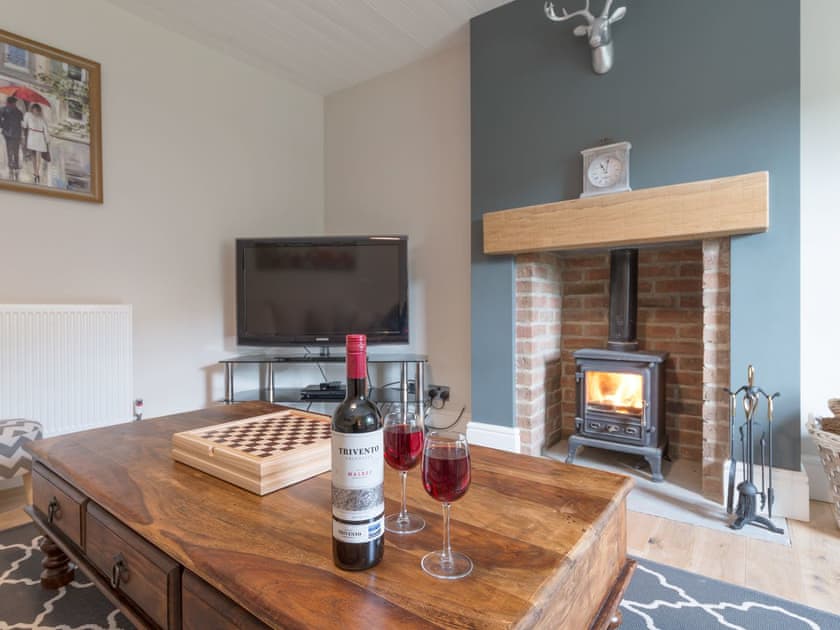 Inviting living room with wood burner | Abraham’s Cottage, Langthwaite, near Richmond