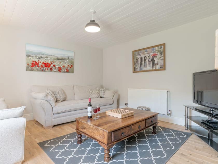 Comfy seating within living room | Abraham’s Cottage, Langthwaite, near Richmond