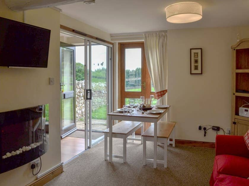 Cosy living/ dining room | The Smithy - Smiths Farm Cottages, Charmouth, near Lyme Regis