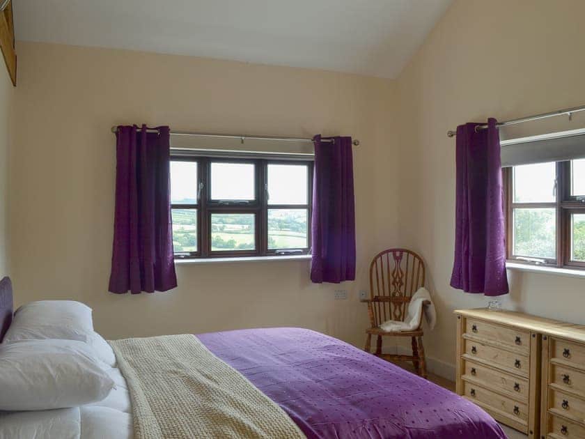 Double bedroom with zip and link super kingsize bed (can be twin beds on request)  | The Barn - Smiths Farm Cottages, Charmouth, near Lyme Regis