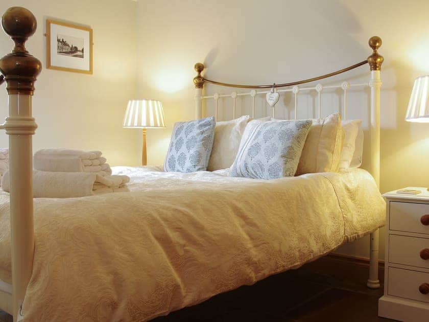 Antique style bed in the double bedroom | The Old Forge, West Lutton near Malton