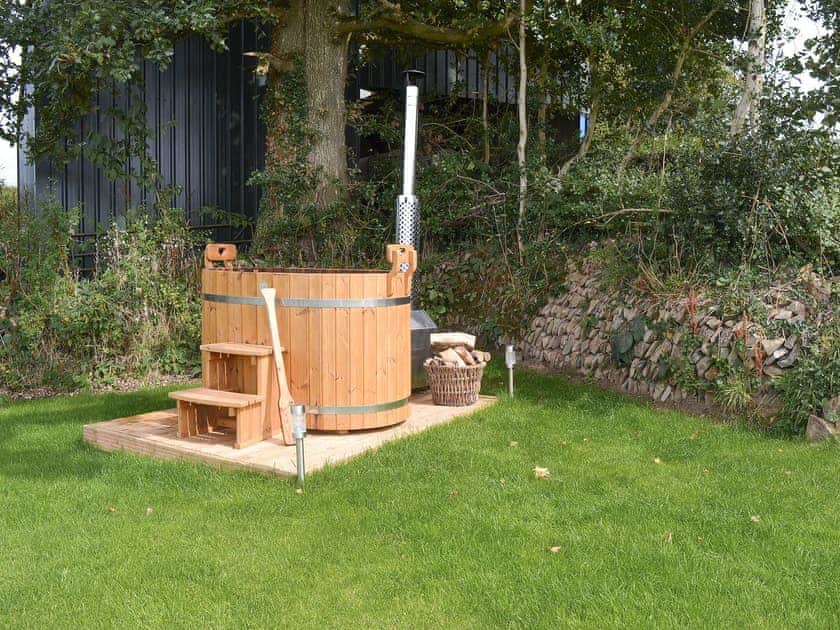 Relax in the sumptuous wood-fired hot tub | The Cart Linhay, Meshaw, near South Molton